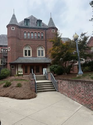 Historic red brick building with twin turrets