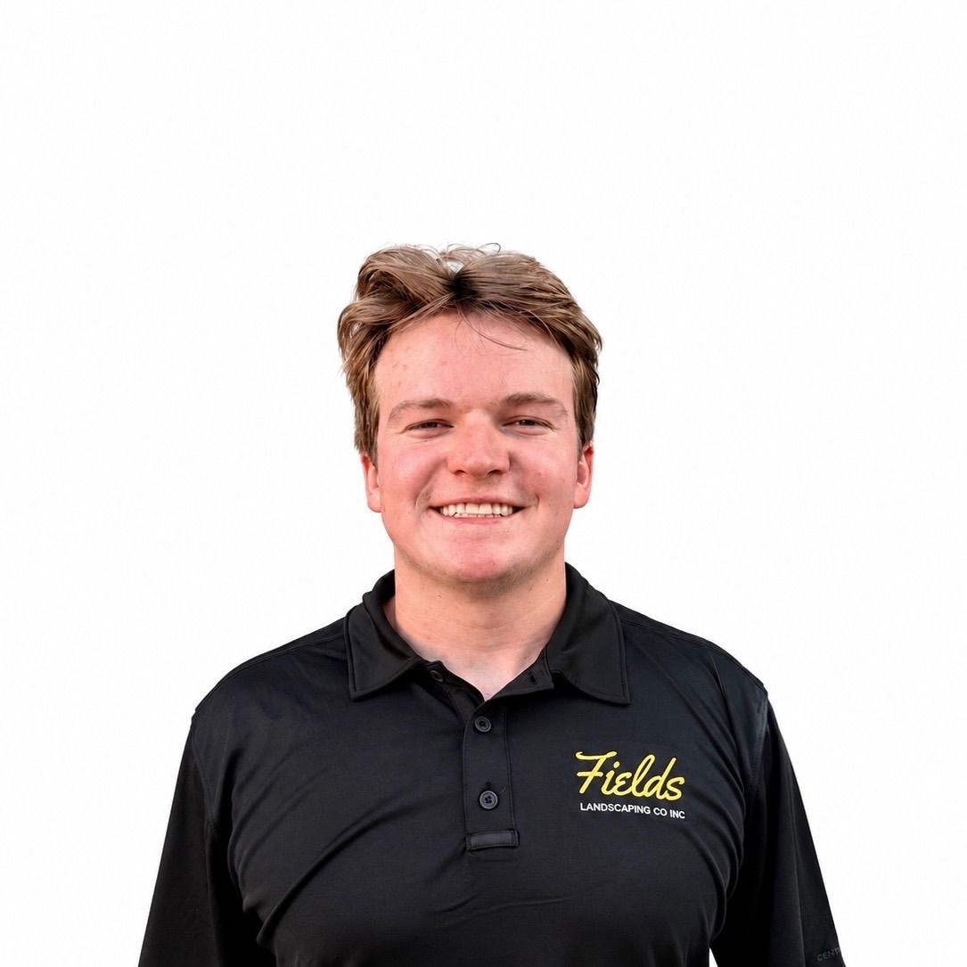 Smiling Fields Landscaping employee in black company polo